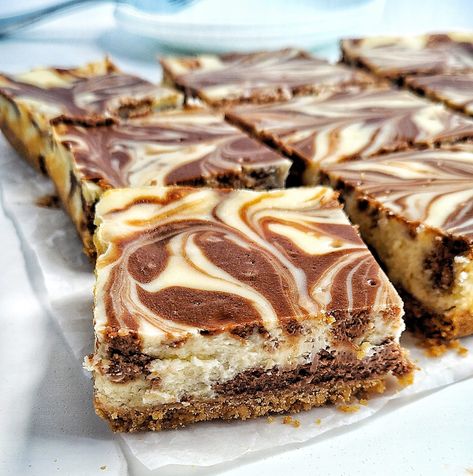 Chocolate-Vanilla Marble Cheesecake Bars Marble Cheesecake, Chocolate Swirl Cheesecake, Pretzel Buns, Chocolate Cheesecake Bars, Cheesecake Bars Easy, Cheesecake Bar, Strawberry Cheesecake Bars, Bakers Chocolate, Cheesecake Bar Recipes