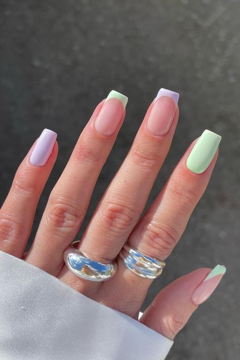 Step into the enchanting world of chic pastel nail art with these mesmerizing lavender and green French tips. Explore the delightful combination of soft lilac and serene mint green that brings a breath of fresh air to your medium-length square nails. Captivating with their glossy finish, these nails radiate understated elegance and springtime vibes. Click through to discover more and indulge in a pop of color! // Photo Credit: Instagram @gelsbybry Easter Nails Easy, Mint Green Nails, Modern Nail Art, Simple Spring Nails, Bunny Nails, Easter Nail Designs, Fun Nail Colors, Nail Color Trends, Cute Spring Nails