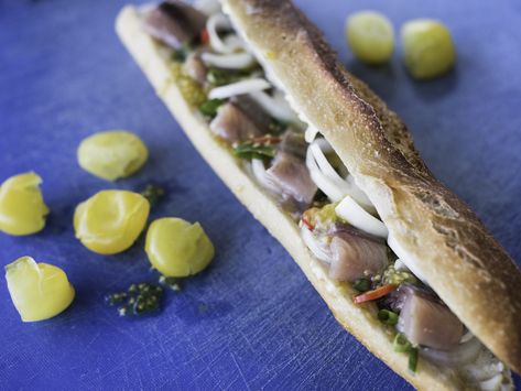 Located in Shuk HaNamal, the Sherry Herring sandwich kiosk shares views of the beautiful Tel Aviv port. Chef Sherry Hansky crafts delicious creations in front o Herring Sandwich, Herring Fish, Herring Recipes, Fish Sandwich, Jewish Recipes, Frugal Meals, Kiosk, Hot Dog Buns, Seafood Recipes