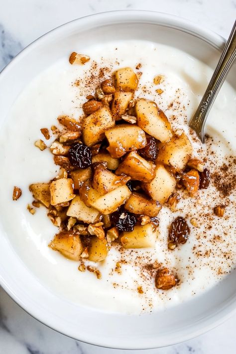 Indulge in a delicious and nourishing breakfast with this homemade cinnamon apple Greek yogurt bowl. Perfect for a quick and healthy start to your day, this easy recipe combines the sweetness of cinnamon-spiced apples with the creaminess of Greek yogurt. Packed with protein, calcium, and natural sweetness, this bowl will keep you satisfied and energized throughout the morning. Try adding some crunchy granola or chopped nuts for an extra dose of texture and flavor. Apple Yoghurt Bowl, Apple Greek Yogurt, Granola Yogurt Bowl, Greek Yogurt Breakfast Bowl, Greek Yogurt Bowl, Apple Yogurt, Best Greek Yogurt, Yogurt Bowls, Greek Yogurt Recipes