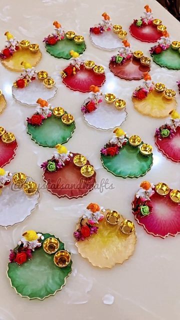 Krystals and Krafts💝 shared a post on Instagram: "Completing a bulk order is always fun!!🥰 These beautiful colours ❤️ Ganeshji Puja plates 💗 Size:-5" . . Dm to order 💌 . Follow us @krystalsandkrafts . . #resin #resinartwork #artist #instareels #instagram #instagramforbusiness #business #reelsinstagram #reelkarofeelkaro #reelsviral #reelsofinstagram #reelitfeelit❤️❤️ #shareit #feature #explore #explorepage #fyp #smallbusinesssupport #smallbiz #womenownedbusiness #entrepreneur #reeloftheday Resin Return Gift Ideas, Resin Pooja Thali Ideas, Resin Tilak Thali, Resin Arti Thali, Rakhi Thali Resin, Resin Items For Diwali, Resin Pooja Plate, Resin Pooja Thali, Resin Puja Thali