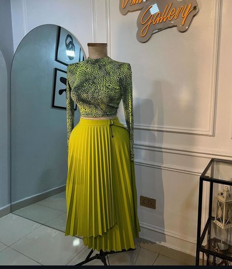 FASHION UPDATE ‼️‼️‼️ Rocking a pleated skirt or trousers with a chic structured top is trending now. It’s a stunning, classy, and modest look. What do you think of this style? Are you going to give it a try? Share your thoughts below! #pleatedskirt #pleated trouser #explorefashion#nigeriafashion#bellanaija#asoebibella#asoebi#fashiondesigner#naijafashiondesigner#sewing#tailor# Pleat Skirt Outfit, Pleated Skirt Outfit, Skirts Midi High Waisted, Asoebi Styles, Pleated Trousers, Event Outfit, Church Outfits, Fashion Updates, Skirt Top