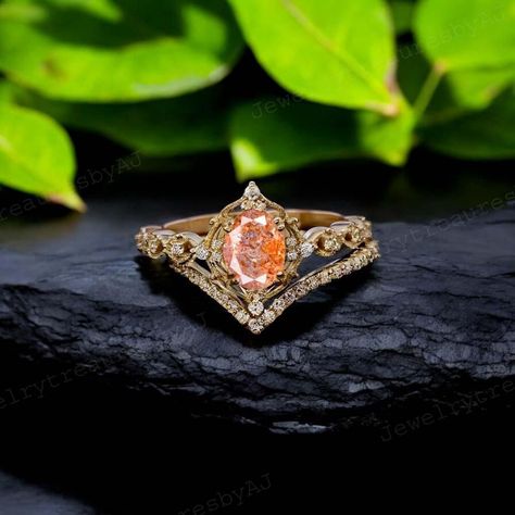 Oval Sunstone Engagement Ring Set, Curved Stacking Band, Orange Gemstone Bridal Ring Set, 14k Solid Gold Wedding Jewelry, Mother's Day Gift Main Stone- Sunstone (Natural ) Stone Shape:  Oval Stone Color: Orange  Stone Size: 8x6 MM Second Stone - CZ Diamond Stone Shape - Round  Stone Color - Colorless *Ring Size :- US 3 to US 10 -------------------------------------------------------------------------------------------------------------------------------------------------------------- Customized Design: For custom making jewelry, it can be made in 2 different metals 1. Solid gold, including 14/18k white/yellow gold. 2. 925 sterling silver with white/yellow/rose gold plated. we can change stone and design according to your choice but price will be change. Standard Delivery : The delivery tim Sunstone Engagement Ring, Orange Stone, Gold Wedding Jewelry, Stacking Bands, Bridal Ring Set, Oval Stone, Cz Diamond, Yellow Roses, Diamond Stone