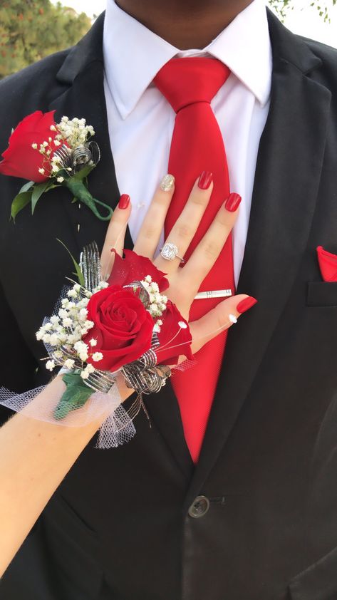 I wore this with a red dress and silver shoes! It worked really well ❤️ Hoco Corsage For Black Dress, Black Prom Dress Red Accessories, Prom Coursage Ideas Black And Red, Black And Red Prom Flowers, Black Prom Dresses With Red Heels, Black And Red Prom Aesthetic, Red Prom Tux Guys, Red Prom Dress With Black Heels, Tux With Red Dress Prom