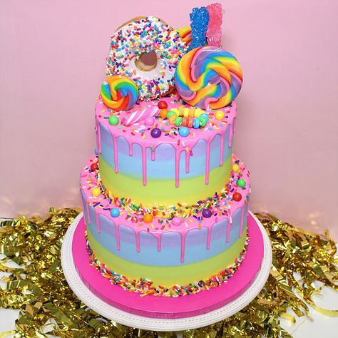 Two Tier Rainbow Donut Cake Rainbow Cake With Candy On Top, Rainbow Donut Cake, Candy Land Cakes, Candy Land Birthday Cake, Colorful Candy Cake, Candyland Theme Cake, Candyland Birthday Cake, Giant Donut Cake, Rainbow Candy Cake