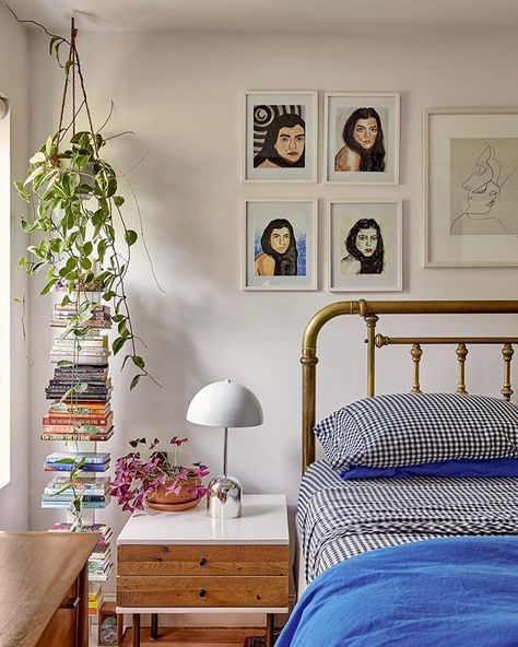 Using this bedroom corner as a design formula moving forward. Hanging plant + book stack + gallery wall = Success. Head to the link in our bio for more decorating ideas you're going to want to steal. Photo by @aaronbengo, design by @sunnyshokrae #SOdomino Small Bedroom With Armoire, Cost Bedroom Ideas, Plant Wall Bedroom, Brooklyn Townhouse, Small Bedroom Decor Ideas, Gallery Wall Bedroom, Small Bedrooms, Bedroom Corner, Small Bedroom Decor