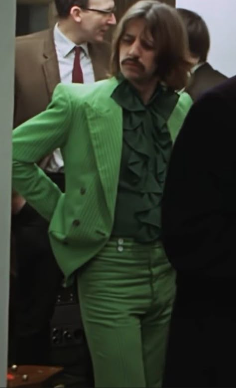 picture of ringo starr, formerly of rock band the beatles, in a green suit. the jacket and trousers are a lighter shade of green, the frilled shirt being darker. the image is taken from the teaser video from the 'get back' documentary coming out august 27th, 2021. The Beatles Fashion, Beatles Fashion, Ringo Star, Danny Green, Beatles Ringo, Beatles Pictures, Green Suit, I'm With The Band, The Fab Four