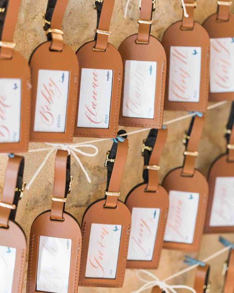 Insanely Creative Escort Cards and Seating Displays | Martha Stewart Weddings - Guests traveled to their seats with the help of these leather luggage tags, which doubled as useful favors for this reception. #wedding #weddinginspiration #escortcard #escortcarddisplay #weddingdecor Creative Seating Cards, Luggage Tag Wedding Favor, Luggage Tags Wedding, Reception Seating Chart, Wedding Reception Seating, Inexpensive Wedding Favors, Best Wedding Favors, Wedding Favors Fall, Reception Seating