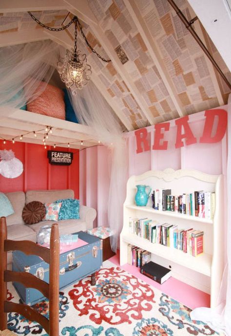 The ceiling is lined with book pages, tulle hangs from above to add softness, and a full bookshelf and bright rug add color and texture to the tiny space. Kids Shed, She Shed Interior, Playhouse Interior, Shed Playhouse, Garden Escape, Shed Interior, Build A Playhouse, Wendy House, Outdoor Sheds