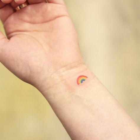 Rainbow tattoo on the wrist Rainbow Wrist Tattoo, Double Rainbow Tattoo, Simple Rainbow Tattoo, Minimalist Rainbow Tattoo, Small Rainbow Tattoo, Rainbow Tattoo Ideas, Misaki Mei, Tattoo On The Wrist, Micro Tattoo