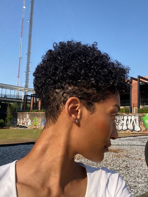 Curly short tapered hairstyle for short hair. Women with textured hair and short length on the sides. Curly hairstyle for black women. #curlyhairstyles #curlyhaircare #curlygirlmethod #shorthairstyles #shorthair #africanamericanhairstyles #blackhairstyles #curlyhairideas #curlyhaircare #pixie #pixiecut #pixiehair Shave Hair Styles For Women Black, Short Hair Mixed Women, Women With Fade Haircut, Short Curly Hair Women Natural Curls, Tapered Afro Women, Pixie Cut Black Women Curly, Short Curly Fro Black Women, Natural Short Cuts For Black Women, Short Curly Haircuts Black Women