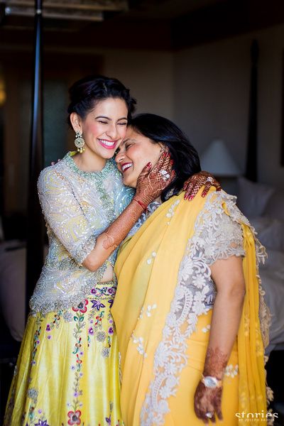 Mother of the Bride - Bride in a Yellow Floral Lehenga with a White Sequinned Jacket and the Mother in a Yellow Saree with Lace Borders | WedMeGood #wedmegood #motherofthebride #motherofthebrideoutfit #yellow #mehandioutfit #sangeet Mother Daughter Poses, Mother Daughter Photoshoot, Indian Wedding Dresses, Mother Daughter Photos, Mother Daughter Photography, Pink Lehenga, Mother Of The Bride Outfit, Beautiful Wedding Photos, Mom And Daughter