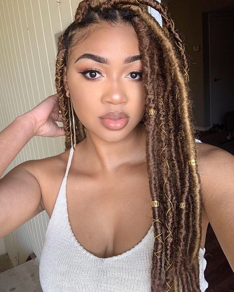 Light brown and blonde faux locs Faux Locs Hairstyles Brown, Brown Goddess Faux Locs, Brown Blonde Faux Locs, Light Brown Faux Locs Black Women, Blonde Faux Locs Styles Goddess, Light Brown Soft Locs, Light Brown Faux Locs, Brown Faux Locs Black Women, Brown Goddess Locs