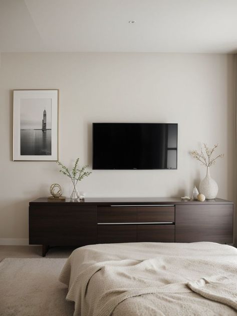 Make a statement in your bedroom by hanging a gallery wall of diverse artwork above your TV. Pair it with a sleek media console and stylish accent lighting for a contemporary and sophisticated look. Accent Lighting, Media Console, Sophisticated Look, Gallery Wall, Sleek, Media, Tv, Bedroom, Lighting