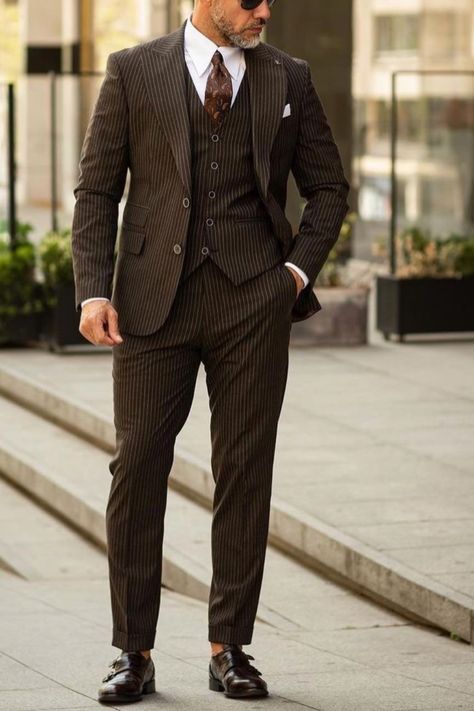 A brown pinstripe suit like this makes the perfect wedding suit for any man. Groom stye like this suit wil make you stand out at your wedding, while complimenting your partner. If you would like a suit like this custom made for you, book an appointment online with us at Giorgenti New York! Pinstripe Suit Wedding, Pinstripe Suit Outfit, Pin Stripe Suit Mens, Brown Suit Wedding, Brown Pinstripe Suit, 1920s Suit, Prom Vibes, Suit For Men Wedding, Suit Inspiration