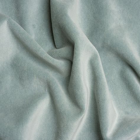 Soften your space with this pastel Banton Breeze Cotton and Polyester Upholstery Velvet. Luxe interiors begin with velvet, a textile equal in modern sophistication as comfort. The muted, light sea-blue face brings this cotton and polyester fabric down to earth, displaying a digestible color ideal for blending with other textures, colors, and design styles.  Featuring a soft face, modest luster, and supple drape, you can easily elevate your home with tufted headboards, throw pillows, and armchair Soft Fabric Texture, Tufted Headboards, Green Velvet Fabric, Elegant Bohemian, Soft Face, Blue Face, Pale Aqua, Mood Fabrics, Luxe Interiors