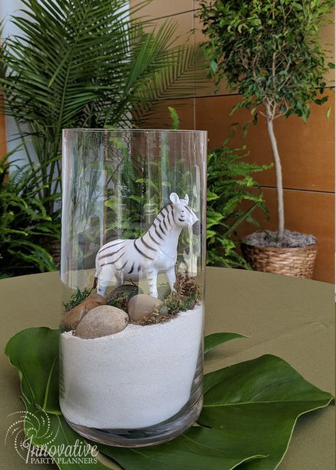 Maryland Zoo neighborhood represented by our zebra centerpiece and lots of plant rentals at opening reception for the Student and Youth Tourism Association  hosted by Visit Baltimore | by Innovative Party Planners | 410-998-9999 Safari Party Table Decor, Jungle Centerpieces Ideas Safari Theme, Zoo Party Centerpieces, Jungle Theme Table Decor, Zoo Table Decorations, Simple Safari Centerpieces, Party Animals Centerpieces, Jungle Table Decorations, Jungle Centerpieces Ideas