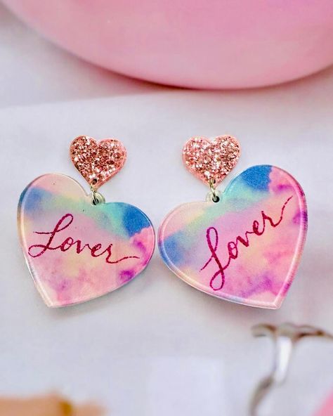 $14 LOVER ERA Earrings Get ready to make a statement with the stunning Lover Era Earrings! 2” long 1.5” in diameter Acrylic Order yours here⬇️ https://tealtigershop.com/products/lover-era-earrings?utm_content=ios&utm_medium=product-links&utm_source=copyToPasteboard 📦Ships from MS, next business day, or pick up in store at 767 Church St, Lucedale, MS. 🛍️ #loverera #earrings #boutique #boutiqueshopping #shopsmall Lover Era, Business Day, Boutique Shop, Small Shop, Get Ready, Ios, Pick Up, In Store, Ships