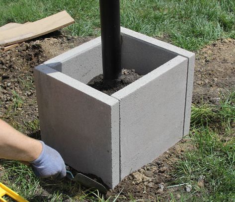 Diy Post Planter, Paver Planter Ideas, Post In Concrete Planter, Cement Post In Bucket, 4x4 Posts In Planters, Planter Around Post, Planter Around Mailbox Post, Pillar Planter Ideas, Mailbox Planter Ideas Diy Projects