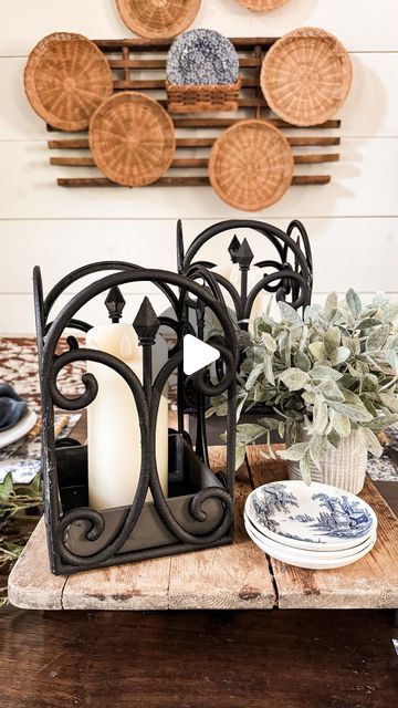 Rachel Harper - Decorating / DIY on Instagram: "I’m drawn to black wrought iron decor and loved the look of the Amalfi lanterns as soon as I saw them. However, I would never purchase them at that price. Then I remembered seeing the Dollar Tree garden fence with a similar design and decided to give it a try. It is a surprisingly easy project, and I’ll show you exactly how to make your own Dollar Tree Do It Yourself Craft.
.
You only need two items from Dollar Tree 
* a garden fence 
* a wood box 
And you can make this lantern for under $3.00. That’s over a $100 savings 🤦‍♀️
.
If you’d like to see the full detailed tutorial, comment “LANTERN” and I’ll send you the link on your DM. 
.
Let me know what you think! 😘
.
Have the best day! 🥰
.
#dollartreecrafts #diylantern #candlelantern 
#thep Dollar Tree Sconces Diy, Dollar Tree Picture Frame Lantern, Dollar Tree Spider Candle Holder, Wire Basket Candle Holder, Dollar Tree Skull Candle Holder, Wrought Iron Decor, Diy Lanterns, Do It Yourself Crafts, Garden Fence