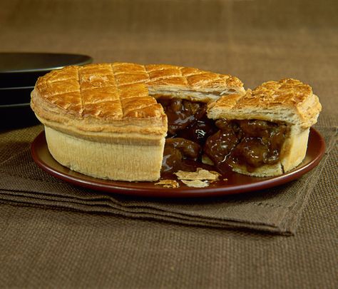 Steak and kidney pie is a national favorite in Britain. This recipe produces a golden pastry with a hearty, meaty filling perfect for colder months. Steak And Kidney Pie Recipe, Kidney Pie Recipe, Beef And Guinness Pie, Kidney Pie, Steak And Kidney Pie, Beef Chuck Steaks, Meat Pie Recipe, Hp Sauce, Beef Pies