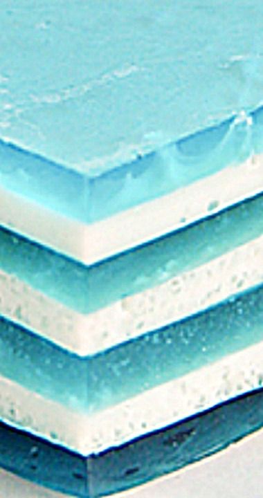 Baby Blue Layered Jello - Perfect for a party, this layered Jello treat is not only fun to make, but it's fun to eat! Blue Jello Recipes, Blue Jello Salad, Sky Jello With Fluffy Clouds, Blue Jello Dessert, Mermaid Jello, Blue Jello Cups, 21 Layer Jello, Blue Jello With Fish, Rainbow Layered Jello