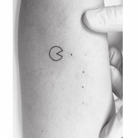 Pac-Man tattoo located on the inner arm, minimalistic Game Controller Tattoo, Pac Man Tattoo, Minimalist Gaming Tattoo, Mr And Mrs Pacman Tattoo, Pac-man Tattoo, Matching Pacman Tattoos, Space Invaders Tattoo, Pacman Tattoo, Pac-man Ghost