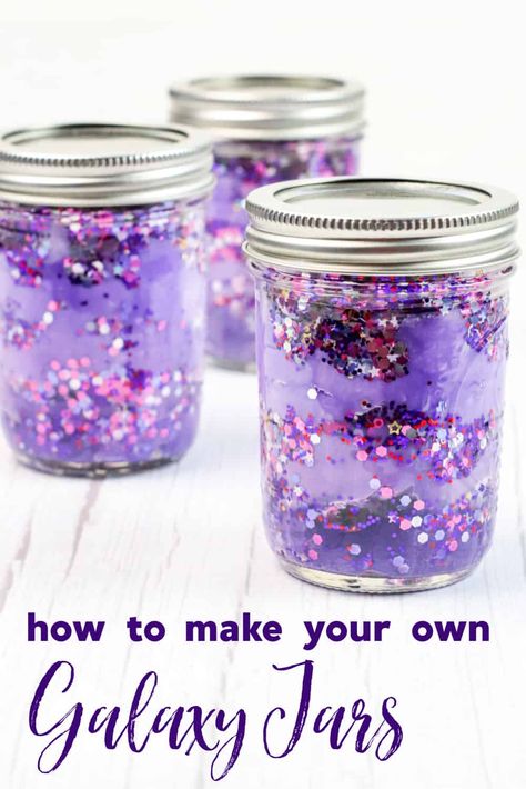 This fun and easy craft is perfect for space fanatics of all ages. With just a few simple supplies, you can create your own DIY galaxy in a jar. These gorgeous sensory jars are the perfect way to relax, calm down, and unwind. Stellar Craft Ideas, Galaxy Jar Craft, Galaxy Crafts For Toddlers, Craft With Jars, Out Of This World Crafts, Galaxy Jars Diy For Kids Easy, Sensory Jars Diy, Calming Jars For Kids Diy, Galaxy Jars Diy For Kids