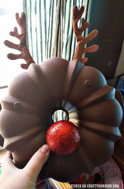 Bundt cake pan rudolph the reindeer christmas wreath...such a fun craft! Bundt Pan Christmas Crafts, Bundt Cake Pan Crafts, Repurposed Bundt Pan, Bundt Cake Pan Pumpkin Craft, Bundt Pan Crafts Ideas, Bundt Pan Crafts, Bundt Pan Pumpkin Craft, Mop Gnomes, Reindeer Crafts