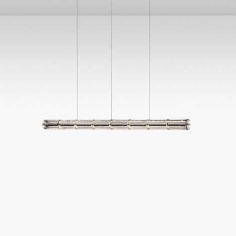 The Luce Orizzontale suspension light by Flos consists of interconnected glass modules that reach a length of 1.66 m (S1) 2.07 m (S2) 2.49 m (S3) with 2.70 m suspended power cable. The cylindrical transparent glass modules are created through an artisanal process by pouring the glass into a rotating mould to obtain an exclusive finish that makes each single piece unique. Internal structure in polished extruded aluminum equipped with two linear LED modules for direct and indirect lighting downwar Wall Scones, Suspended Lighting, Indirect Lighting, Linear Pendant, Suspension Light, Extruded Aluminum, Ceiling Rose, Led Module, Design Museum