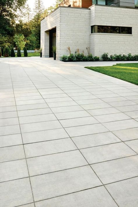 Linear, clean lines and smooth textures call for a modern driveway! Feature large pavers that look like slabs and that is the perfect way to modernize your home entrance! Modern Driveway Landscaping, Driveway Landscaping Ideas, Driveways Landscaping, Modern Driveway, Cobblestone Driveway, Large Pavers, Landscape Pavers, Asphalt Driveway, Outdoor Paving