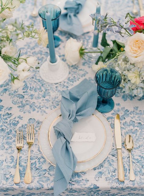 Blue Modern Wedding Decor, Wedding Place Setting Knotted Napkin, Blue Glass Cups Wedding, Vintage Dusty Blue Wedding, Vintage Blue And White Wedding Theme, Isle Liners For Wedding, Napkin Wedding Setting, Japanese Wedding Decorations Table Settings, French Blue Table Setting