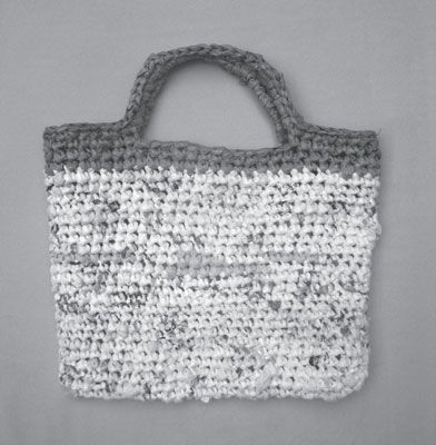 As more and more plastic grocery bags are being replaced by cloth totes, why not turn your leftover plastic bags into a reusable crocheted bag? Plastic bags can be crocheted like yarn; they just need a little bit of prep work to become plastic yarn, or plarn. If you don’t have enough plastic bags to … Crochet Grocery Bag, Grocery Bag Pattern, Plastic Bag Crafts, Plastic Yarn, Plastic Bag Crochet, Recycled Bags, Upcycle Plastic, Recycled Plastic Bags, Plastic Shopping Bags