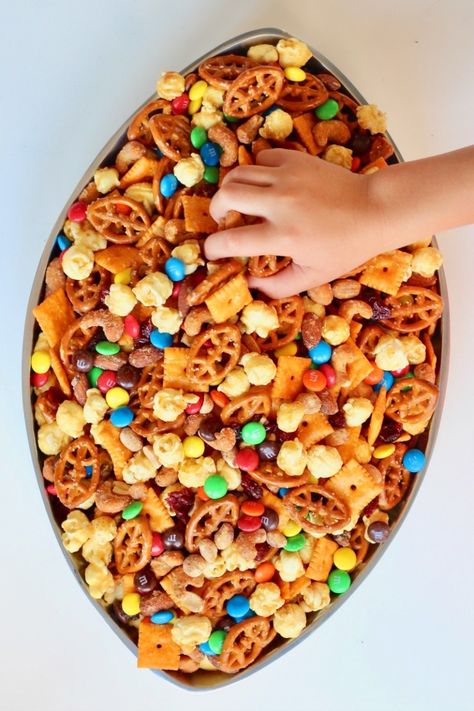 Touchdown Snack Mix | The BakerMama Salty Football Snacks, East Football Snacks, Super Bowl Chex Mix Recipes, Football Trail Mix Super Bowl, Football Chex Mix Recipes, Tailgate Snack Ideas, Tailgate Snacks Outdoor, Kids Football Snacks, Touchdown Snack