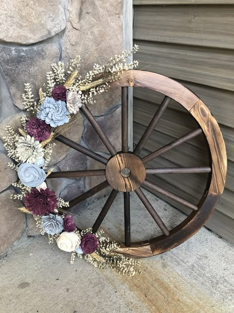 Wagon wheel decorated with Sola Wood flowers, wheat and white floral filler. #diy #solawoodflowers #wagonwheel #rustic #wedding #decor Flower Wagon, Wood Flower Wreath, Wagon For Wedding, Wagon Wheel Decor, Creative Garden Decor, Western Themed Wedding, Wheel Decor, Door Wreaths Diy, Garden Decor Ideas