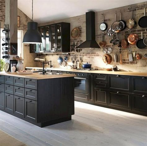 Timeless kitchen with brick walls and black wood cabinets along with wooden countertops - Decoist Industrial Kitchen Design Ideas, Kitchen With Brick Wall, Dapur Rustic, Backsplash With Dark Cabinets, Industrial Kitchen Design, Kabinet Dapur, Brick Kitchen, Brick Backsplash, Black Kitchen Cabinets