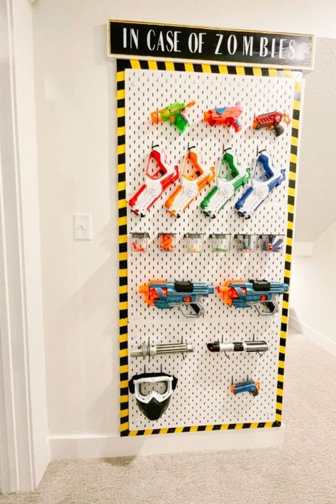 Create your own DIY Nerf Gun Wall for easy storage and organization in boys' rooms! We'll provide you with a step-by-step guide on how to build it yourself. Visit us for more storage and organization ideas for your home. Nerf Organization Ideas, Boys Room Storage, Garage Clothes, Nerf Wall, Nerf Storage, Boys Room Diy, Office Pantry, Closet Bathroom, Boys Playroom