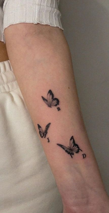 Multiple Butterfly Tattoo Designs, Butterfly With Initials Tattoo, Butterfly Initial Tattoo, Butterfly Tattoos With Names, Butterfly Tattoo With Date, Butterfly Tattoo With Name, Meaning Of Butterflies, Butterfly Tattoos Ideas, Tattoos Representing Family