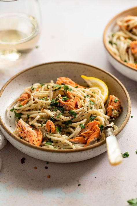 This Lemon Garlic Butter Salmon Pasta recipe is quick and easy to make! You'll love the light yet luxurious garlic butter sauce with lemon, whole-wheat pasta, and flaky salmon. It's a wholesome, filling family dinner quick enough to make on busy weeknights and elegant enough for date night at home! Lemon Butter Salmon Pasta, Lemon Salmon Pasta, Lemon Garlic Butter Salmon, Salmon Linguine, Salmon Pasta Recipe, Chilli Pasta, Pasta With Lemon, Salmon Pasta Recipes, Lemon Butter Salmon