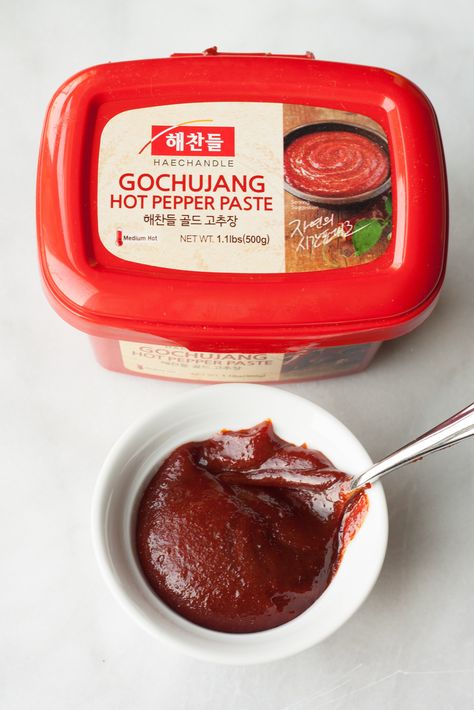 Gochujangor Korean hot red pepper paste: A must have condiment if you like your heat with a hint of sweetness. The Spicy Miso of Korean Cooking —red chile paste that also has glutinous rice, fermented soybeans, salt, sweeteners. Similar to miso paste (a little goes a long way). Use in marinades for meat dishes, stir into dipping sauces, use to punch up stews/soups. Store in fridge once opened. Gochujang Recipes, Driscolls Berries, Korean Sauce, Gochujang Recipe, Meat Store, Pepper Paste, Lunch Appetizers, Korean Cooking, Korean Recipes