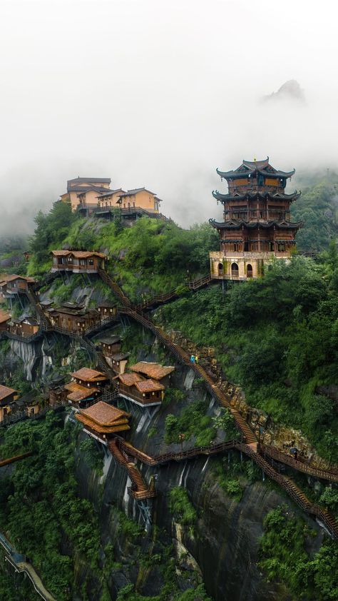 Long-Nong Huang | Traveller | One of the most surreal villages that I’ve seen is located in the province of Jiangxi in China. With wooden houses hanging at the side of a… | Instagram Movie Locations, Wooden Houses, Travel Instagram, Studio Ghibli, Beautiful World, Surrealism, The Good Place, All About Time, Beautiful Places