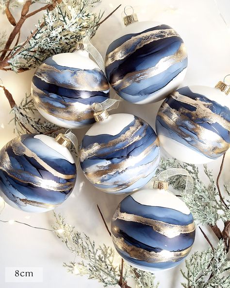 "Navy & Brass Baubles" Available as singles or in a gift set. Elevate your holiday decor with these beautiful handpainted glass baubles. Each ornament is completely unique and features an elegant abstract design painted by hand using alcohol inks. They bring a touch of handcrafted sophistication to any setting, making them a perfect additon to your seasonal collection. Whether adorning your tree or featuring within your home decor, these decorations are unique to the artist Lindsay and something Ceramic Baubles, Gold Caps, Glass Bauble, Sell Gold, Navy Gold, Gold Ink, Handmade Ornaments, Gold Christmas, Christmas Baubles