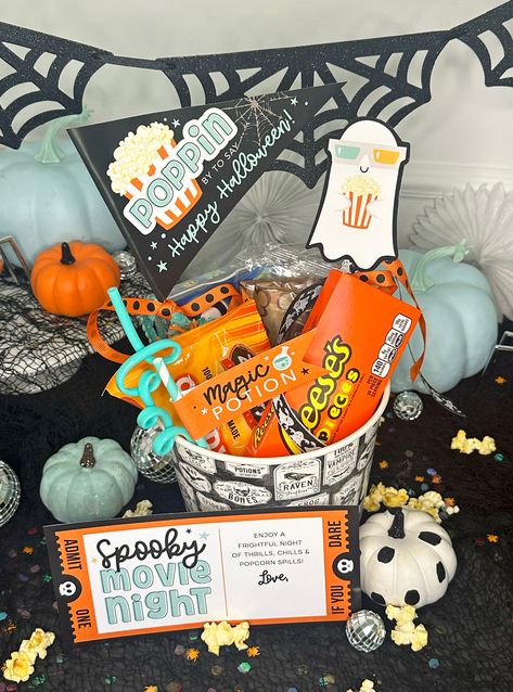 This adorable printable Halloween set is a perfect addition to your spooky movie night gift baskets! Plan a Halloween movie night for your kids or gift to friends and neighbors. Prints on standard 8.5 x 11 inch page. Print as many as you need! Nothing physical will be shipped. Set includes:Spooky Movie Night Card"Poppin by to say Happy Halloween" pennant flag"Magic Potion" straw flagSmall TicketGhost with Popcorn This design is also available in pink: https://pixeldustdesigns.com/products/spooky-movie-night-halloween-movie-night-gift-basket-printables Directions:1. You will receive a pdf download link once payment is complete.2. Easily add a name to card using Adobe Acrobat Reader or simply handwrite name after printing.3. Print on standard 8.5 x 11 inch card stock4. Cut out, fold around w Kids Spooky Basket, Movie Night Basket Ideas, Cute Spooky Basket Ideas For Friends, Halloween Gift Baskets For Kids, Spooky Basket For Him, Boo Basket Ideas For Best Friend, Soda Cakes, Halloween Movie Night Party, Spooky Movie Night