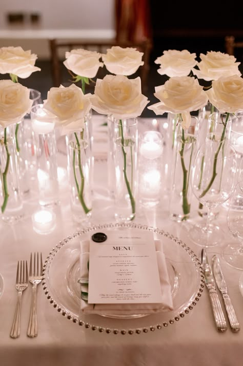 single white rose and candle centerpieces Table Of Honor Wedding, Ballroom Wedding Reception Decoration, White Wedding Centerpieces Simple, White Party Centerpiece Ideas, Flower And Candle Centerpieces Wedding, Wedding High Table Decor, Roses And Candles Wedding, Wedding Table Candle Centerpieces, Pedestal Table Decor