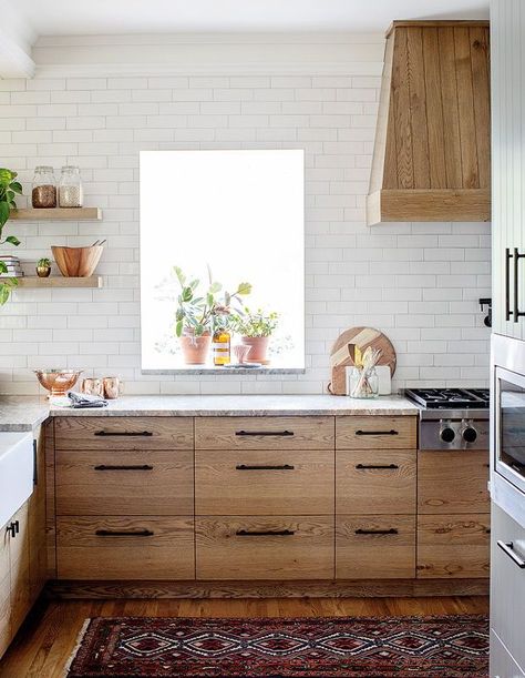 Elegant white subway tile makes the richly veined wood cabinets really stand out. | Photographer: Janis Nicolay | Designer: Kyla Bidgood & Kris Hageland, Bidgood + Co Coin Banquette, Red Oak Floors, Light Wood Cabinets, White Subway Tile Backsplash, Wood Kitchen Cabinets, White Subway Tile, Oak Kitchen, Oak Cabinets, Wood Kitchen