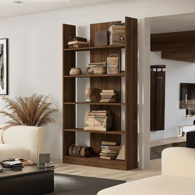 It gives your house a sophisticated touch with its warm walnut hue and streamlined form that fits into any interior theme. With its several shelves, this bookshelf offers plenty of room for storing your books, picture frames, and ornaments. You can maintain a clean and organized living space by keeping your items neatly stored in the extra storage compartments. Inspired by Scandinavian design's simplicity and minimalism, this bookcase blends style with utility. It's the ideal complement to any s Wood Bookshelf Room Divider, Floor To Ceiling Shelves Living Room, Scandinavian Bookshelf Styling, Tall Wall Bookshelves, Tall Shelf Decor Living Room, Bookshelf Living Room Ideas, Modern Bookshelf Wall, Book Shelves Living Room, Walnut Living Room Furniture