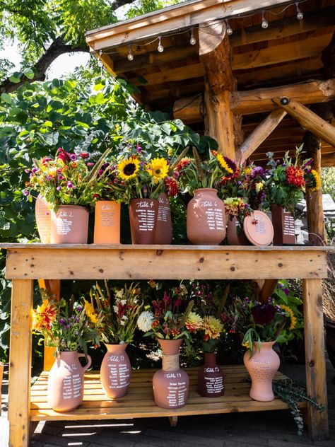 Terracotta Vases as Guest Seating Chart - BOHO Reception Decor | Emily & Casey’s Sunday Kind of Love: A Modern Vintage Wedding Theme at The Gardens of Castle Rock Modern Vintage Wedding Theme, Vintage Garden Wedding Theme, Boho Reception Decor, Boho Reception, Guest Seating Chart, Wedding Seating Chart Display, Vintage Table Decorations, Modern Vintage Wedding, Terracotta Vases