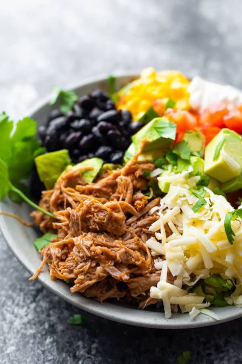 Pulled pork burrito bowls are packed with southwestern flavor and lots of healthy ingredients for a complete one-bowl meal. Easily prep all of your ingredients ahead of time and assemble whenever you're ready to enjoy! #sweetpeasandsaffron #pulledpork #burritobowl #mealprep #lunchmealprep #mealplan Pork Burrito Bowls, Sweet Peas And Saffron, Summer Slow Cooker Recipes, Pork Meals, Burrito Bowls Recipe, Bowl Ideas, Crockpot Pulled Pork, Burrito Bowls, Slow Cooker Pulled Pork