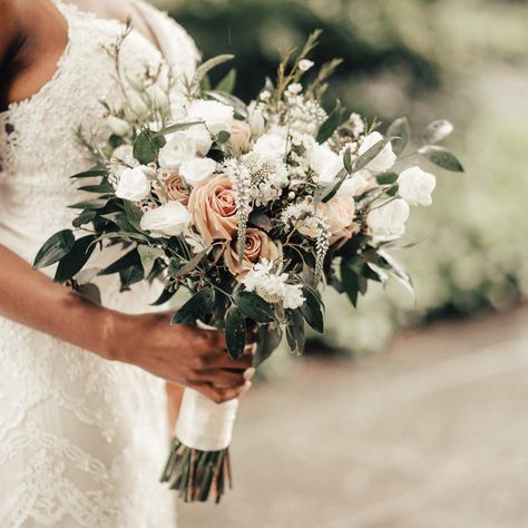 A lush bohemian style white and cream hand-tied bouquet designed with a selection of seasonal blooms such as Roses, Spray Roses, Wax Flower, Veronica and Lisianthus with lush accenting greenery. The stems are artfully wrapped with a double-satin Ivory ribbon for a luxurious finish. Soft Fall Bouquet, Bridal Bouquet Neutral Colors, Sage Green And Blush Flowers, Vow Renewal Bouquet, Boho Style Wedding Bouquet, Sage Green And Light Pink Wedding Bouquet, Earthy Bouquet Wedding, Boho Bridal Bouquet Spring, Beachy Wedding Bouquets