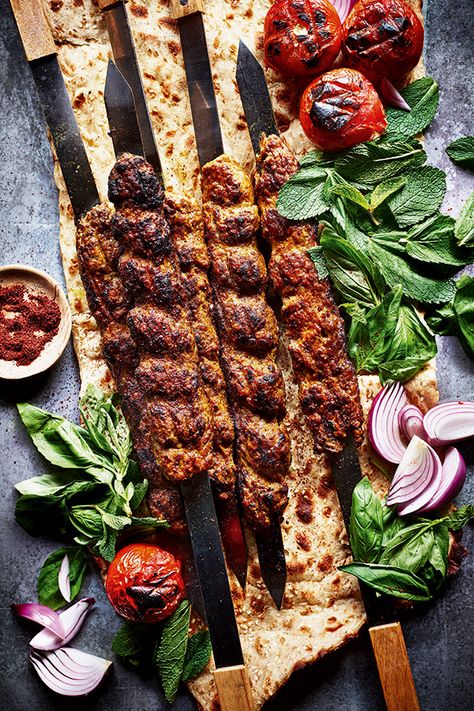 For Persians, kabab koobideh is an institution. The word ‘kebab’ (or kabab, as Persians call it) means ‘to grill’, usually over fire. The first kebabs were made by Persian soldiers who would grill meats on their swords, hence the traditional flat skewers Persians use today – you can buy them online if you want to serve them this way. Although we only have a few different varieties of kebab, for me, this is the simplest yet most delicious. Sabrina Ghayour Recipes, Persian Food Photography, Kebab Food Photography, Iranian Food Photography, Kabab Food Photography, Persian Food Traditional, Iranian Kebab, Persian Kebab Recipe, Kebab Photography